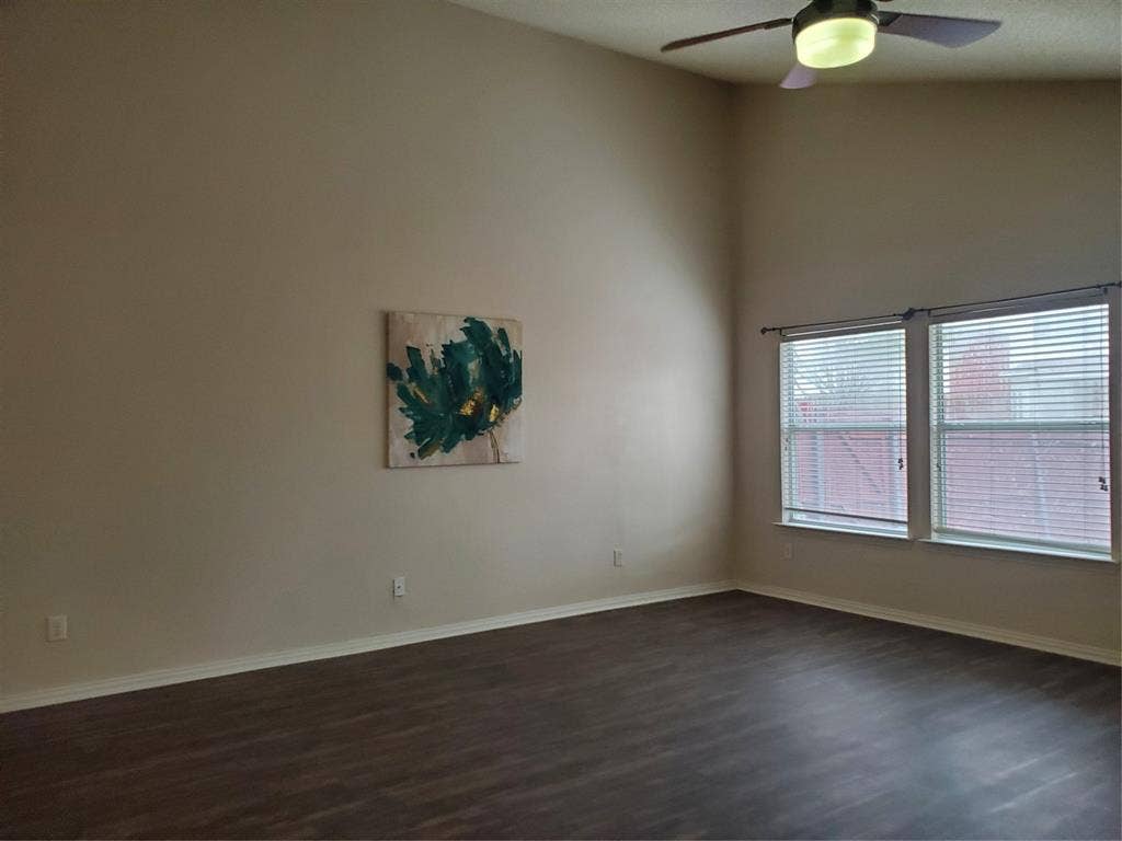 5005 Boxwood Lane, McKinney, TX 75070 2nd View of family room with ceiling fan with remote control and new laminate flooring.