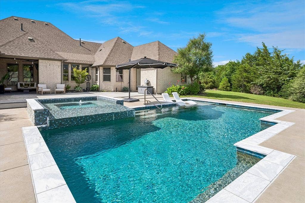 1620 Cattle Drive, Prosper, TX 75078 Pool has tanning ledge