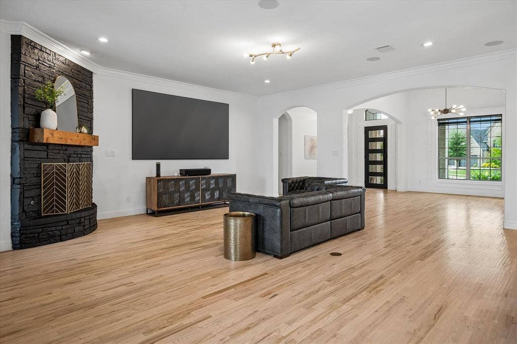 1620 Cattle Drive, Prosper, TX 75078 Living Room has corner fireplace allowing for perfect TV wall