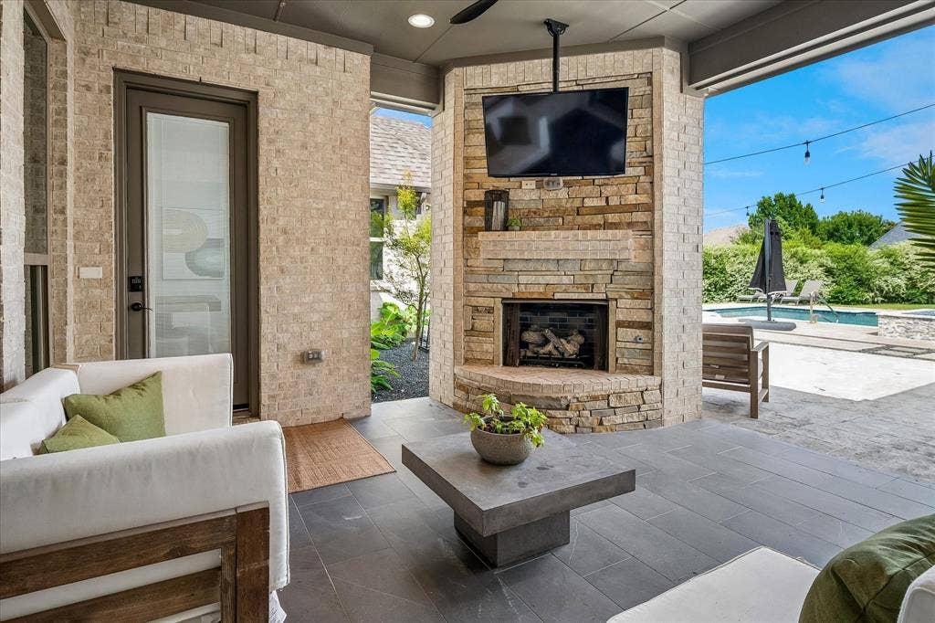 1620 Cattle Drive, Prosper, TX 75078 Covered patio has fireplace with gas logs