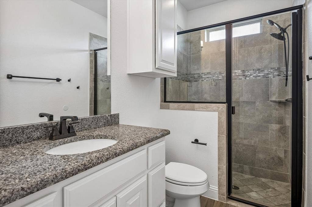 1620 Cattle Drive, Prosper, TX 75078 Bathroom has walk-in shower