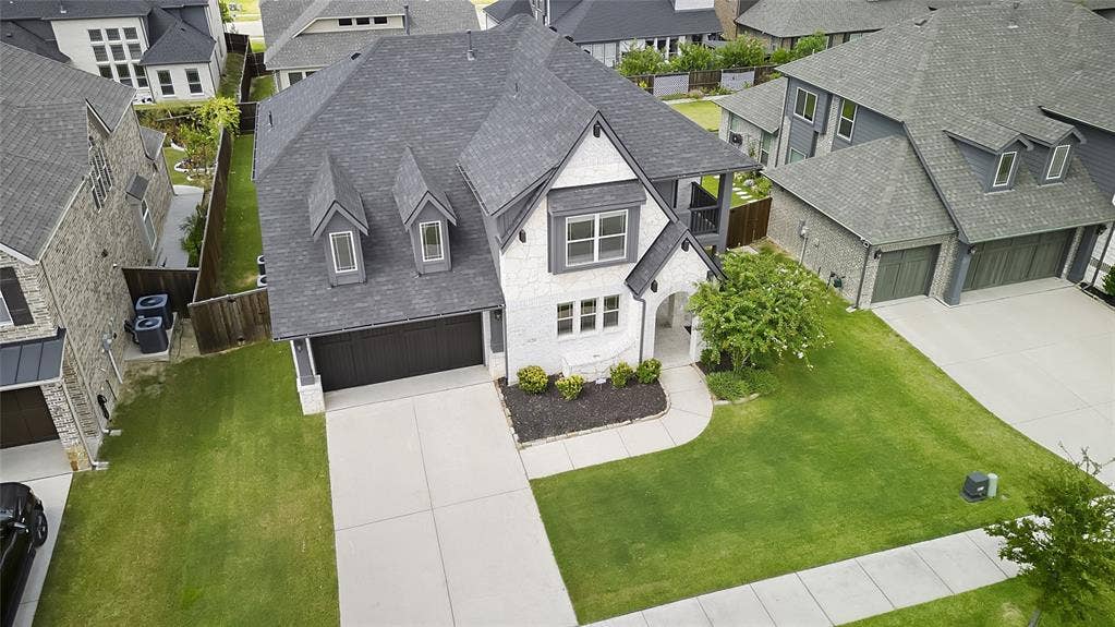620 Shadow Trail, Frisco, TX 75033 Two-story residence featuring a combination of stone and siding facade