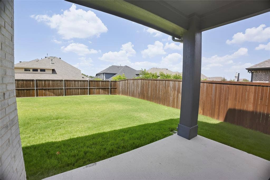 620 Shadow Trail, Frisco, TX 75033 Covered patio with a concrete surface, featuring a square column support and a rain gutter system