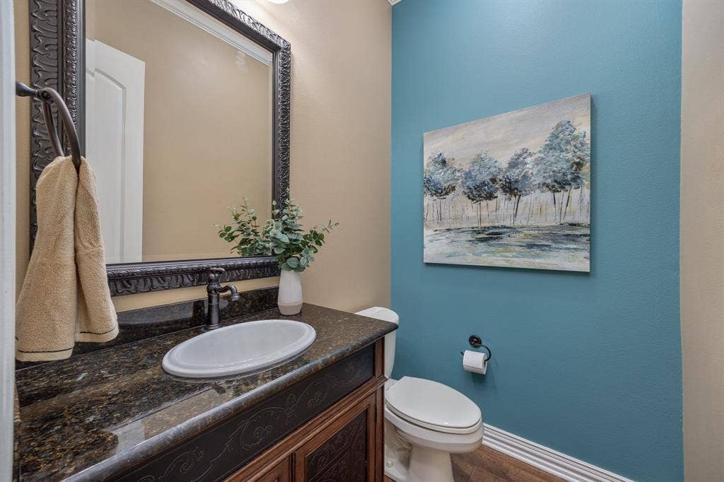 1915 Stonegate Valley Drive, Tyler, TX 75703 Powder room featuring granite countertop