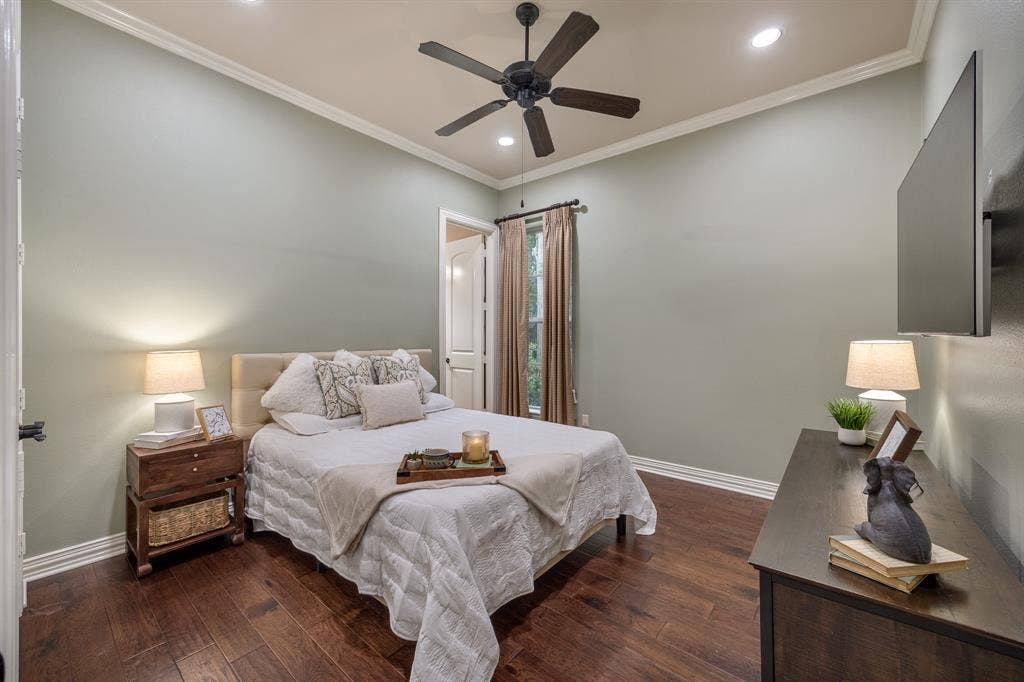 1915 Stonegate Valley Drive, Tyler, TX 75703 Bedroom featuring a ceiling fan with irecessed ceiling lights, crown molding, and wood flooring