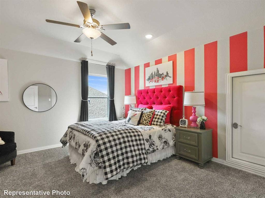 1317 Staffords Point Lane, Anna, TX 75409 Carpeted room featuring a ceiling fan with integrated lighting, a window with dark drapery, and a white paneled door with decorative trim