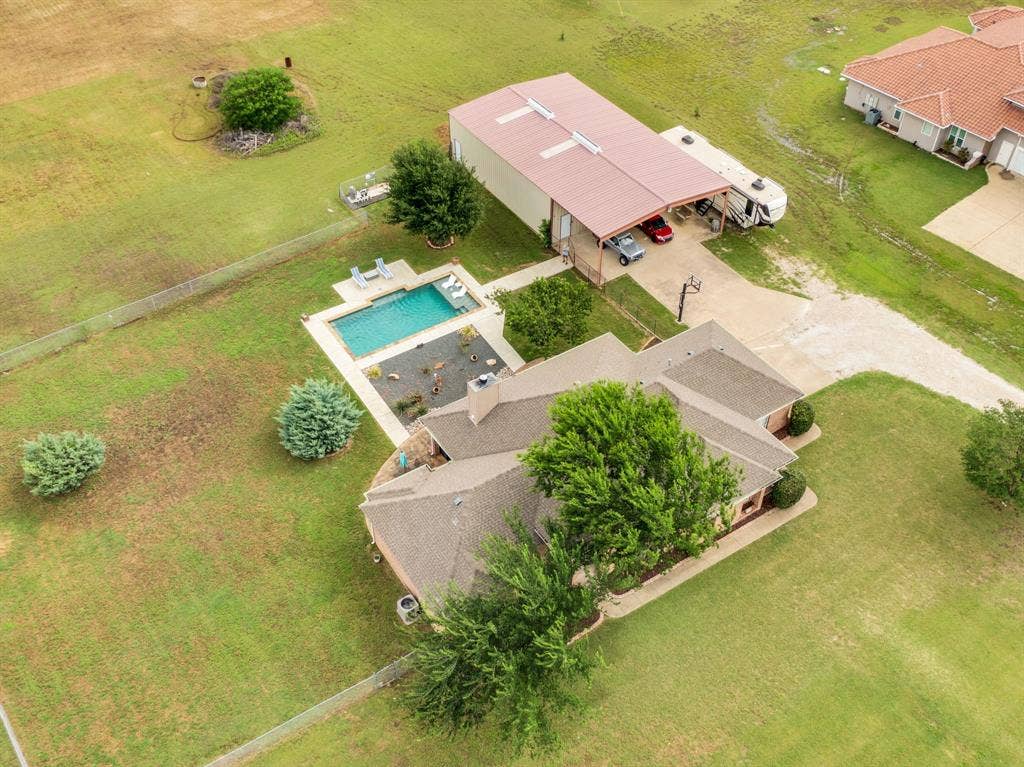 431 Mcalpin Road, Midlothian, TX 76065 Aerial property view featuring a rectangular swimming pool with surrounding patio space