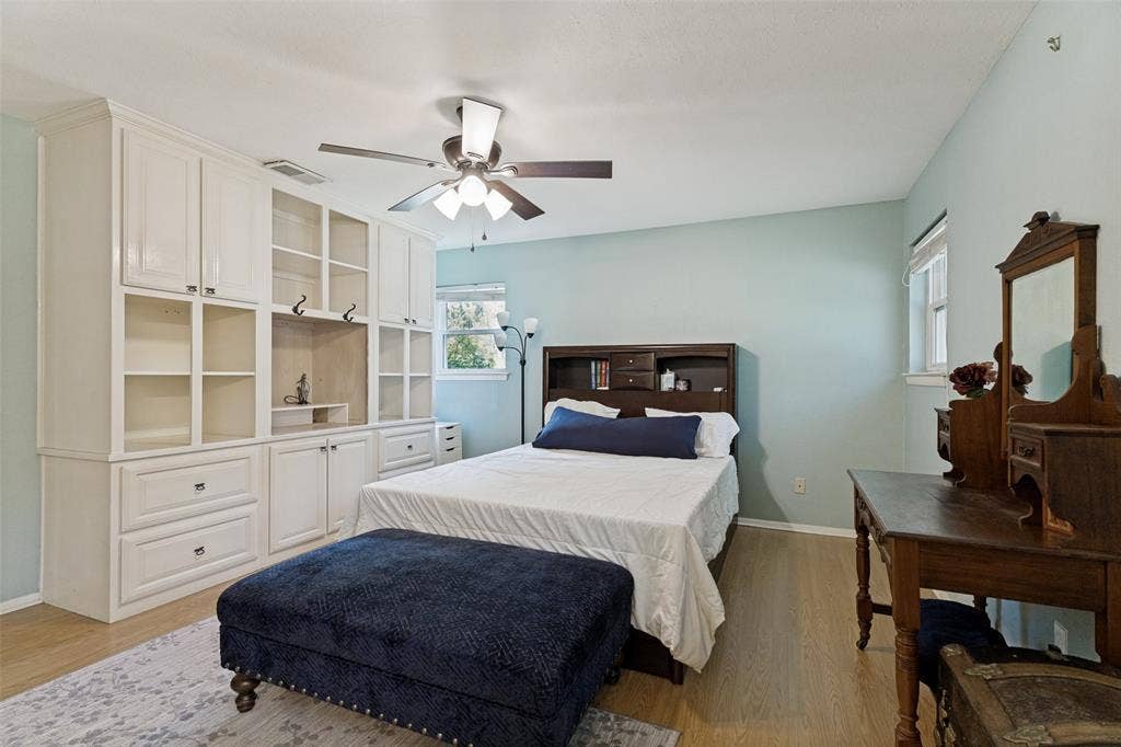 1121 W Redbud Drive, Hurst, TX 76053 Built-in cabinetry with open shelving and closed storage