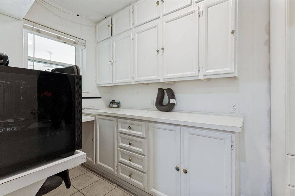 1121 W Redbud Drive, Hurst, TX 76053 Office with built in desk and cabinets.