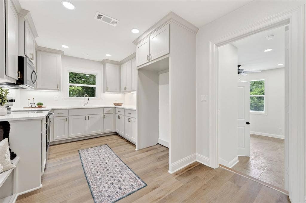 608 Bunny Rabbit Road, Athens, TX 75751 Modern kitchen featuring light cabinetry, quartz countertops, and stainless steel appliances