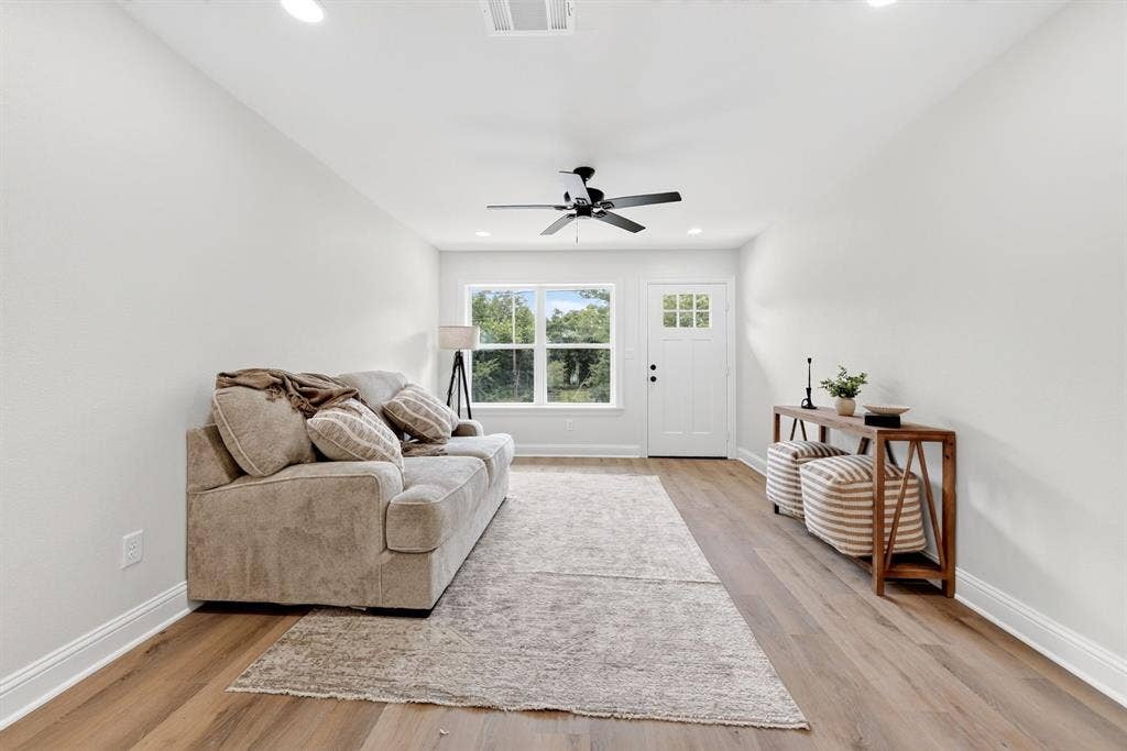 608 Bunny Rabbit Road, Athens, TX 75751 Living area featuring wood-finish flooring, white walls, recessed lighting, and a ceiling fan