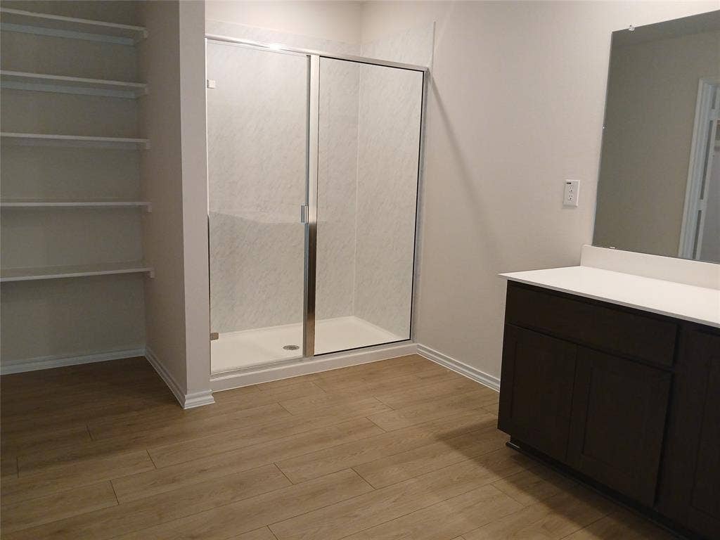 312 Whispering Pine Drive, Royse City, TX 75189 Walk-in shower with clear glass enclosure and sliding door