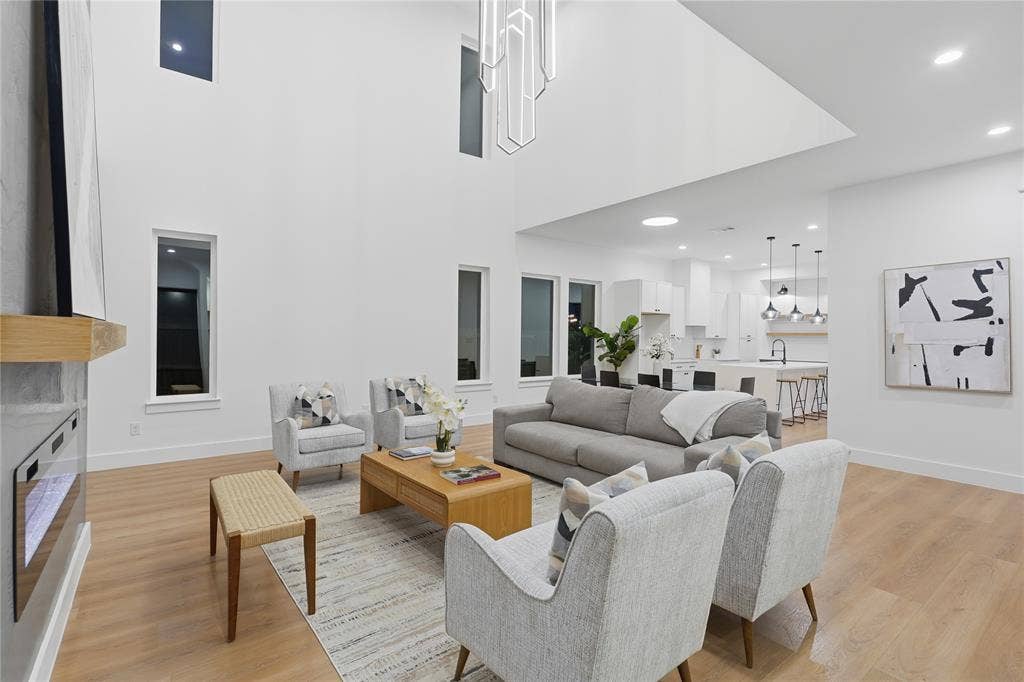 2212 Marburg Street, Dallas, TX 75215 Soaring ceilings with a statement chandelier illuminate this open-concept living space