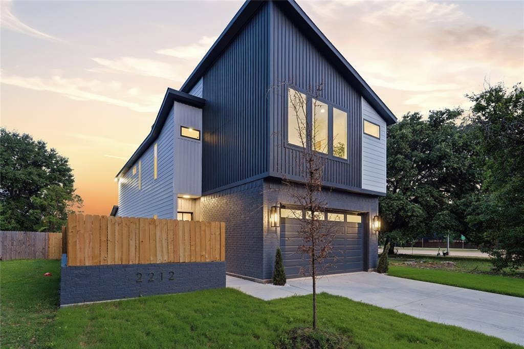 2212 Marburg Street, Dallas, TX 75215 Modern architectural design featuring vertical siding accents and a contrasting brick facade