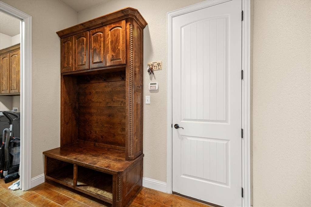 104 Rattling Antler Court, Azle, TX 76020 Space off of the garage to keep shoes, bags, and unload the day.