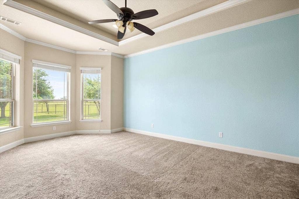 104 Rattling Antler Court, Azle, TX 76020 Large primary bedroom with bay windows and access to back patio.