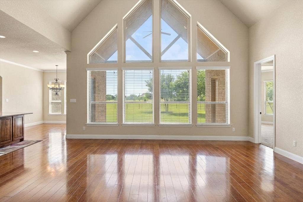 104 Rattling Antler Court, Azle, TX 76020 Beautiful Cathedral ceiling and windows.
