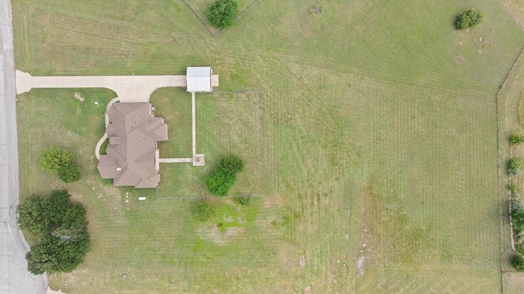 104 Rattling Antler Court, Azle, TX 76020 Detached garage/shop with electric and double sided door access.