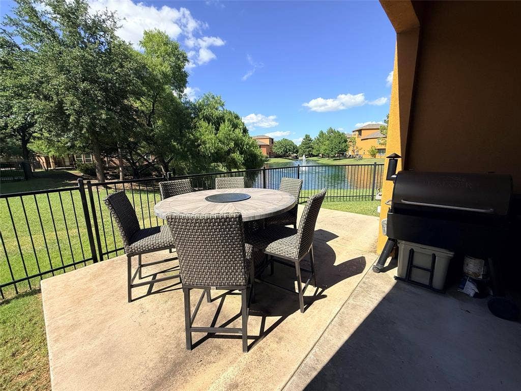 7310 Venice Drive, #4, Grand Prairie, TX 75054 Pretty patio with wrought iron fence looking over pond
