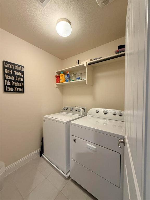 7310 Venice Drive, #4, Grand Prairie, TX 75054 Dedicated laundry area featuring tile flooring, a wall-mounted shelf, a built-in hanging rod, and a flush-mount ceiling light fixture