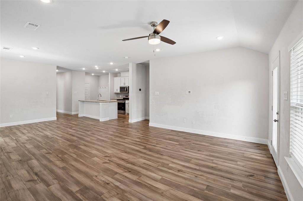 317 Fire Rock Drive, Royse City, TX 75189 Open-concept living area featuring wood-finish flooring, recessed lighting, and a ceiling fan