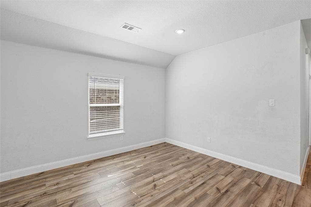 317 Fire Rock Drive, Royse City, TX 75189 Room featuring wood-finish flooring, white baseboards, a window with blinds, recessed ceiling lighting, and light-toned walls