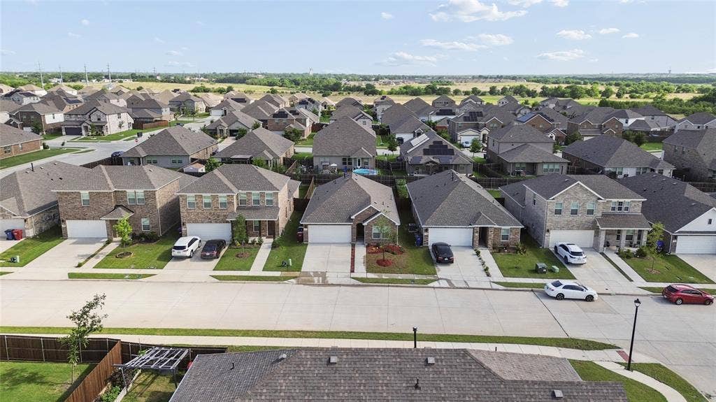 317 Fire Rock Drive, Royse City, TX 75189 Aerial perspective showcasing a residential street with multiple single-family homes