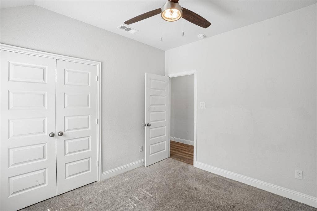 317 Fire Rock Drive, Royse City, TX 75189 Carpeted room with light grey walls