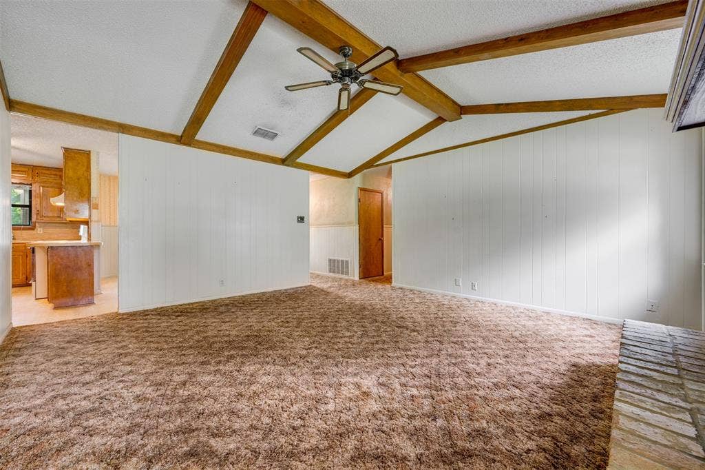 8798 Hill N Dale Road, Tyler, TX 75709 Vaulted ceiling with exposed wood beams and a ceiling fan