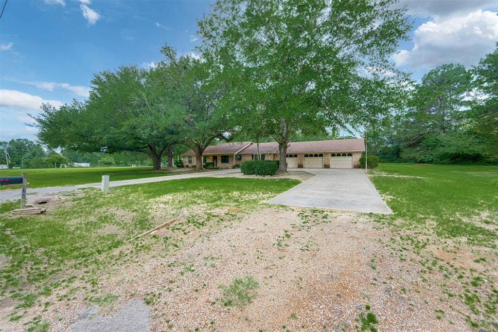 8798 Hill N Dale Road, Tyler, TX 75709 Ranch-style residence featuring a brick exterior and a three-car garage