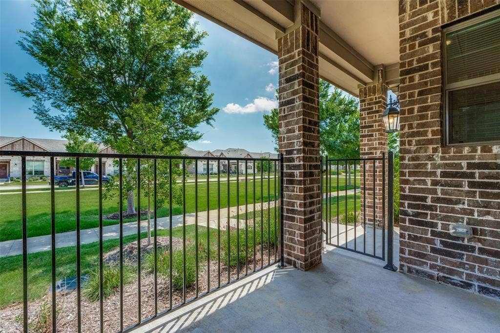 3930 Dalea Drive, Prosper, TX 75078 Covered porch with concrete flooring and brick support columns