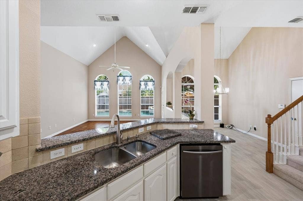 2228 Amy Lane, Plano, TX 75074 High ceilings in Family room and breakfast area - back stairs to the 2nd floor - granite and tumbled marble backsplash - stainless double sink