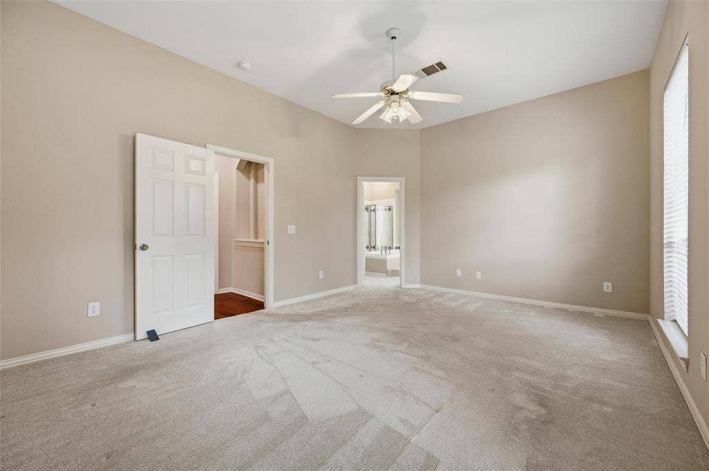2228 Amy Lane, Plano, TX 75074 Doors to the bathroom, hallway - utility room is across from the bedrom on hall - so convenient