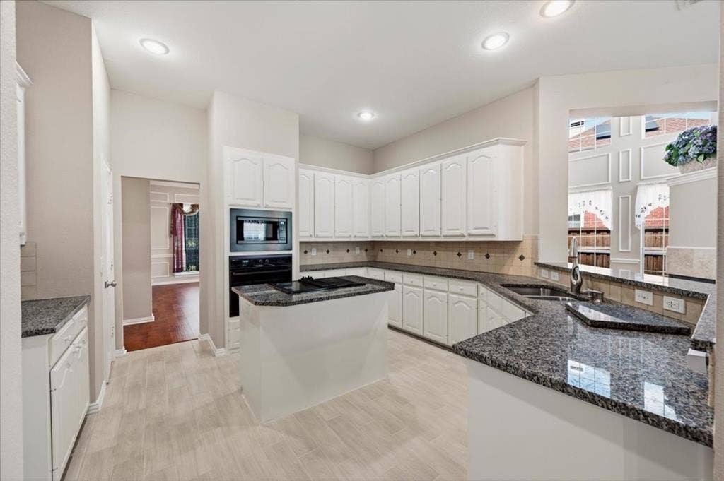 2228 Amy Lane, Plano, TX 75074 NEW FLOORING IN KITCHEN 8/26 - GRANITE COUNTERTOPS AND ISLAND