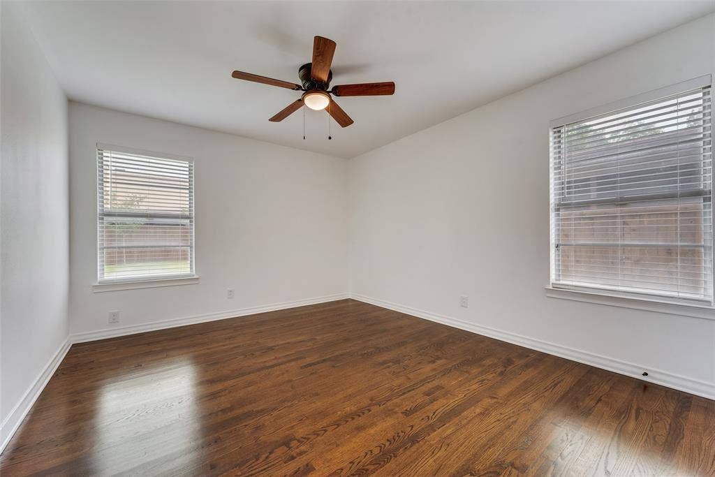 2523 San Medina Avenue, Dallas, TX 75228 Room featuring wood-finish flooring, crisp white walls, and a ceiling fan with integrated lighting