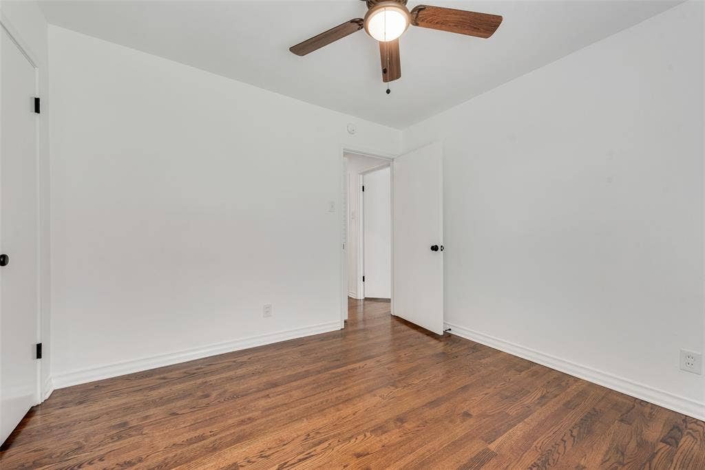 2523 San Medina Avenue, Dallas, TX 75228 Wood-finish flooring with white baseboards