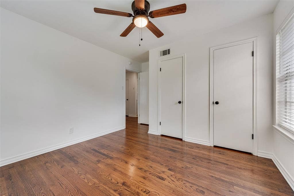 2523 San Medina Avenue, Dallas, TX 75228 Room featuring wood-finish flooring, a ceiling fan with light fixture, and white painted walls