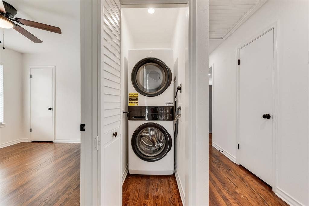 2523 San Medina Avenue, Dallas, TX 75228 Dedicated laundry closet featuring a stacked washer and dryer unit, white louvered bifold doors, and a recessed ceiling light