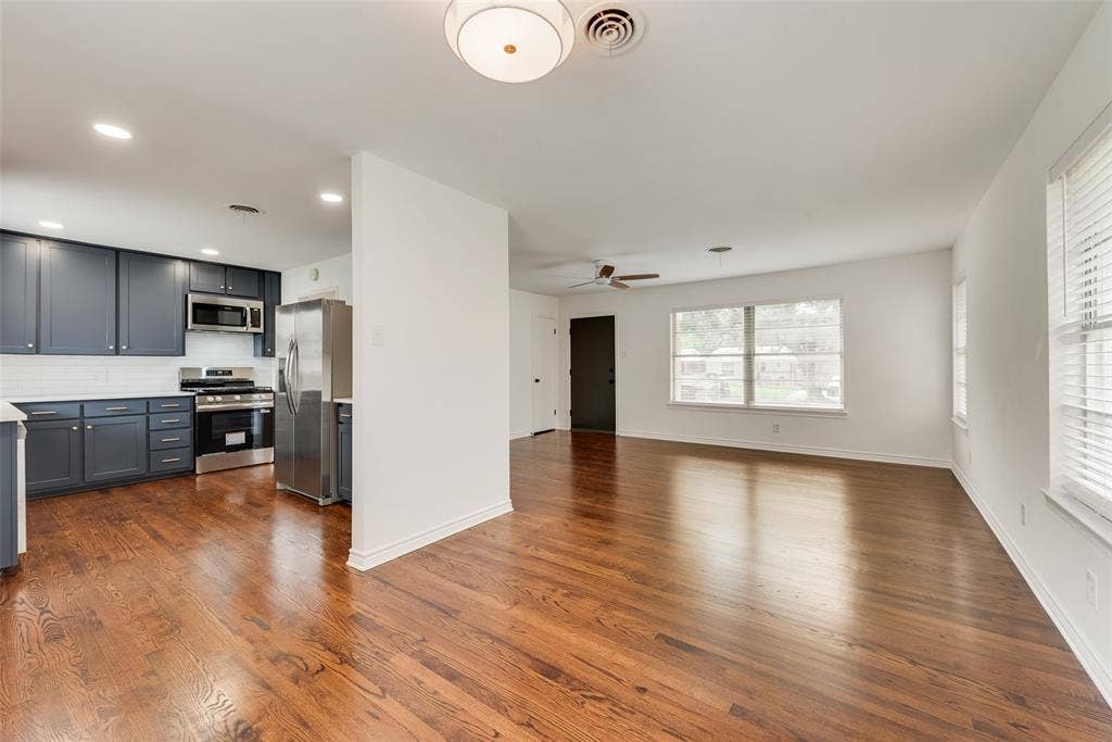2523 San Medina Avenue, Dallas, TX 75228 Open-concept living area and kitchen featuring wood-finish flooring