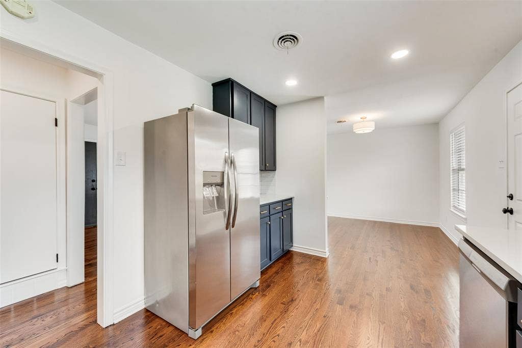 2523 San Medina Avenue, Dallas, TX 75228 Stainless steel refrigerator, recessed lighting, and rich wood-finish flooring