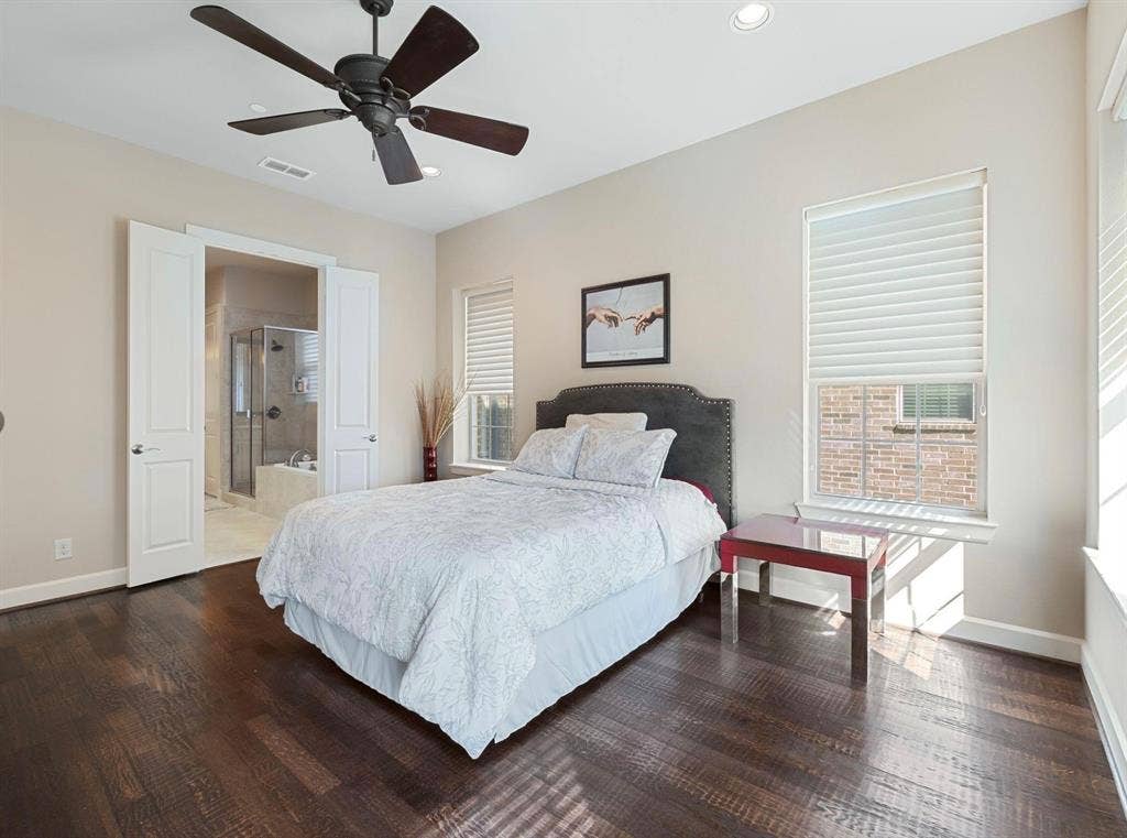 5001 Meridian Lane, #2103, Addison, TX 75001 Bedroom featuring rich wood-finish flooring and a ceiling fan with dark blades