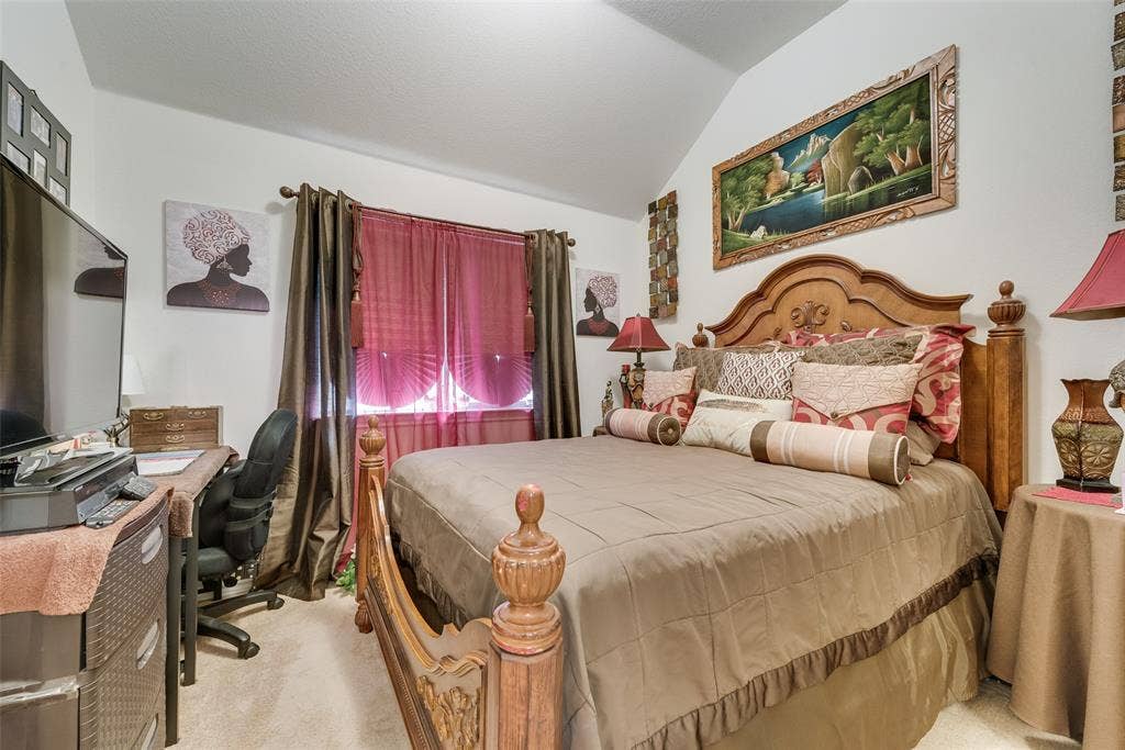 301 Billy Wickliffe Drive, Wilmer, TX 75172 Carpeted room with a vaulted ceiling