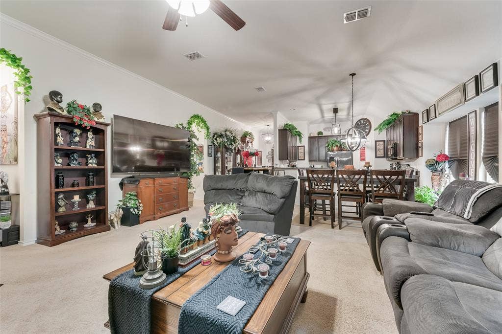 301 Billy Wickliffe Drive, Wilmer, TX 75172 Open-concept living space featuring a spacious carpeted floor, white walls, and a ceiling fan