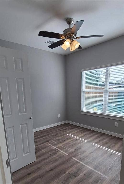9114 Caddo Road, #A & B, Houston, TX 77078 Room featuring vinyl flooring, a ceiling fan with integrated lighting, a window with horizontal blinds, and a white interior door