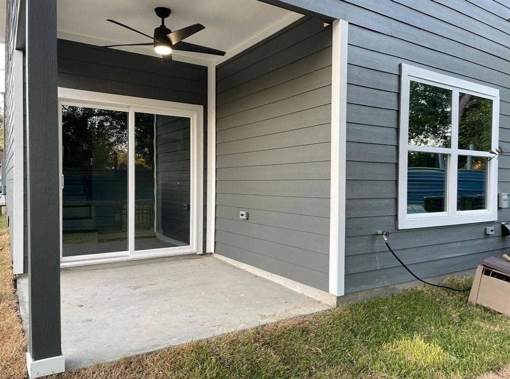 9114 Caddo Road, #A & B, Houston, TX 77078 A private concrete patio extends from the home, offering seamless indoor-outdoor living.