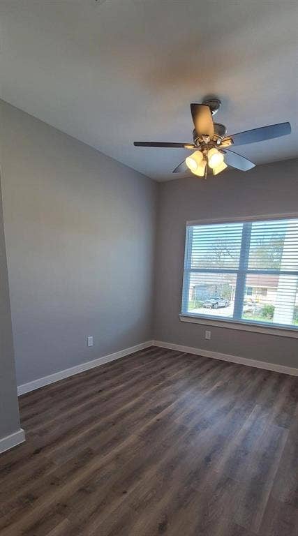 9114 Caddo Road, #A & B, Houston, TX 77078 Bedroom 3 - Spacious room featuring vinyl flooring, light gray walls, and a large window with blinds