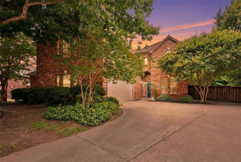 7312 Midcrest Court, McKinney, TX 75072 Large driveway with lots of space, including an oversized garage that fits full size trucks - with room to spare!
