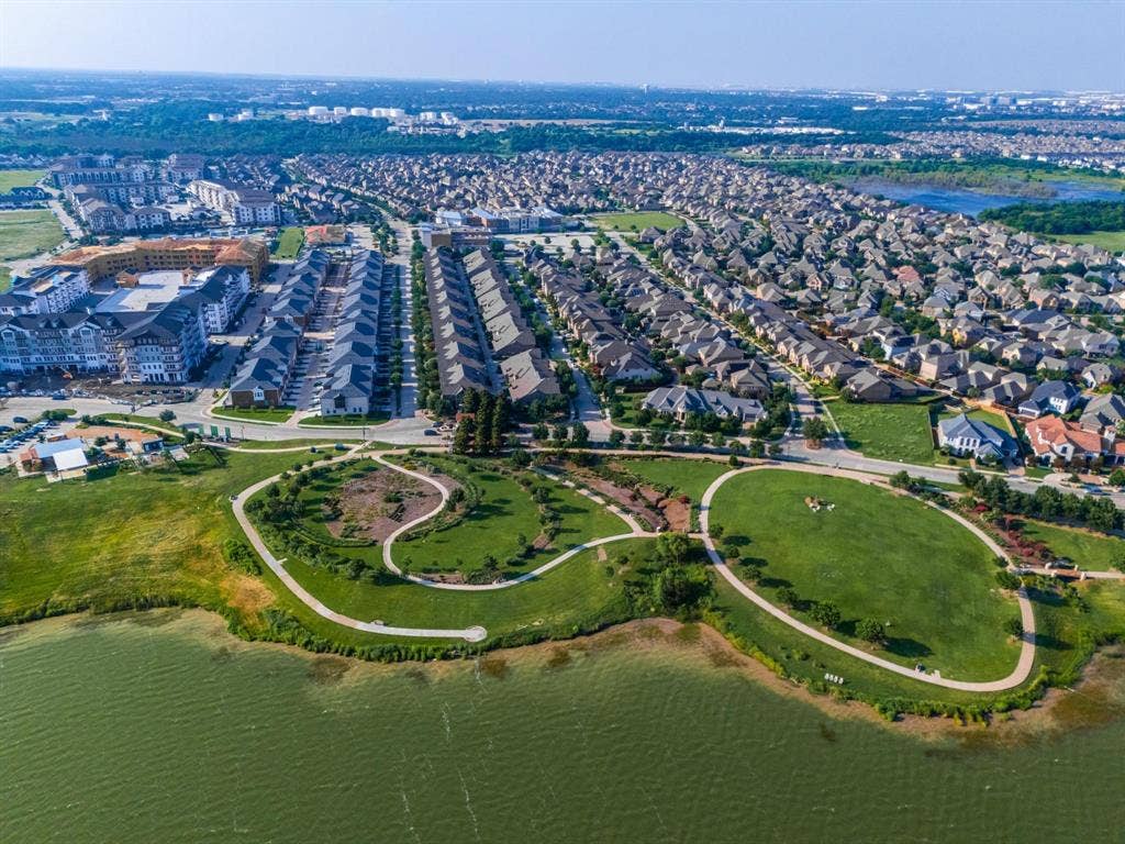 1205 Shady Fox Way, Arlington, TX 76005 Expansive green spaces featuring walking paths, mature foliage, and waterfront access