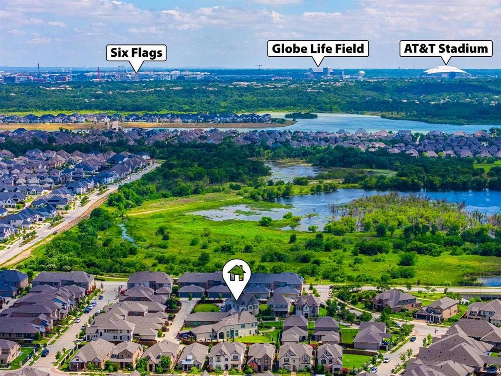 1205 Shady Fox Way, Arlington, TX 76005 Aerial perspective showcasing a residential development with natural water features and green spaces