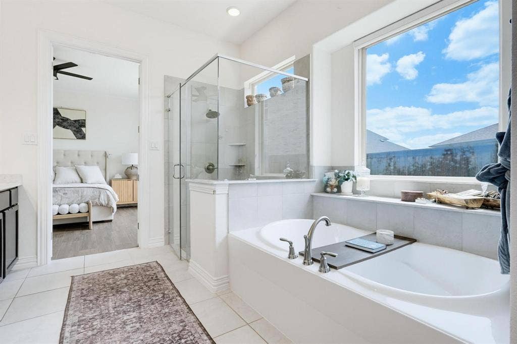1205 Shady Fox Way, Arlington, TX 76005 Soaking tub with deck-mounted faucet and an expansive window